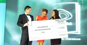 Uche Okonkwo receives her cheque as winner of the Etisalat Flash Fiction Prize