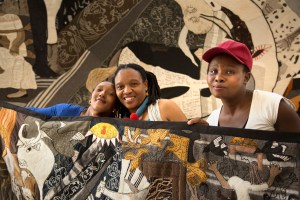 Zoleka, Veronica and Nombulelo with banner close up 6x4